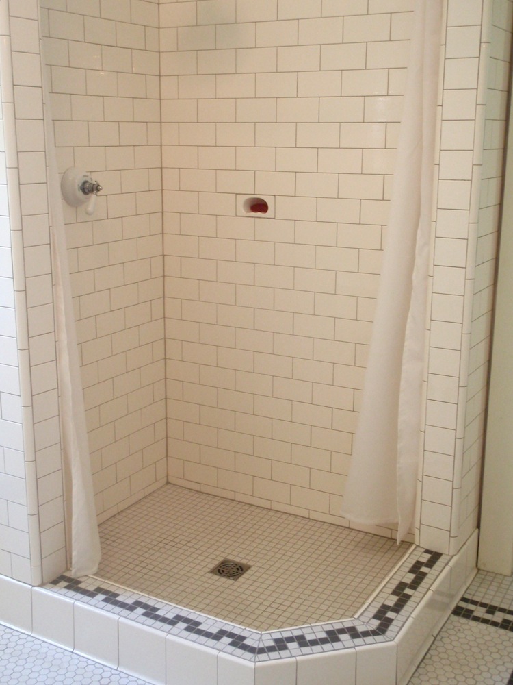 white subway tile on shower wall