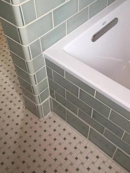 grey subway tile around bathtub